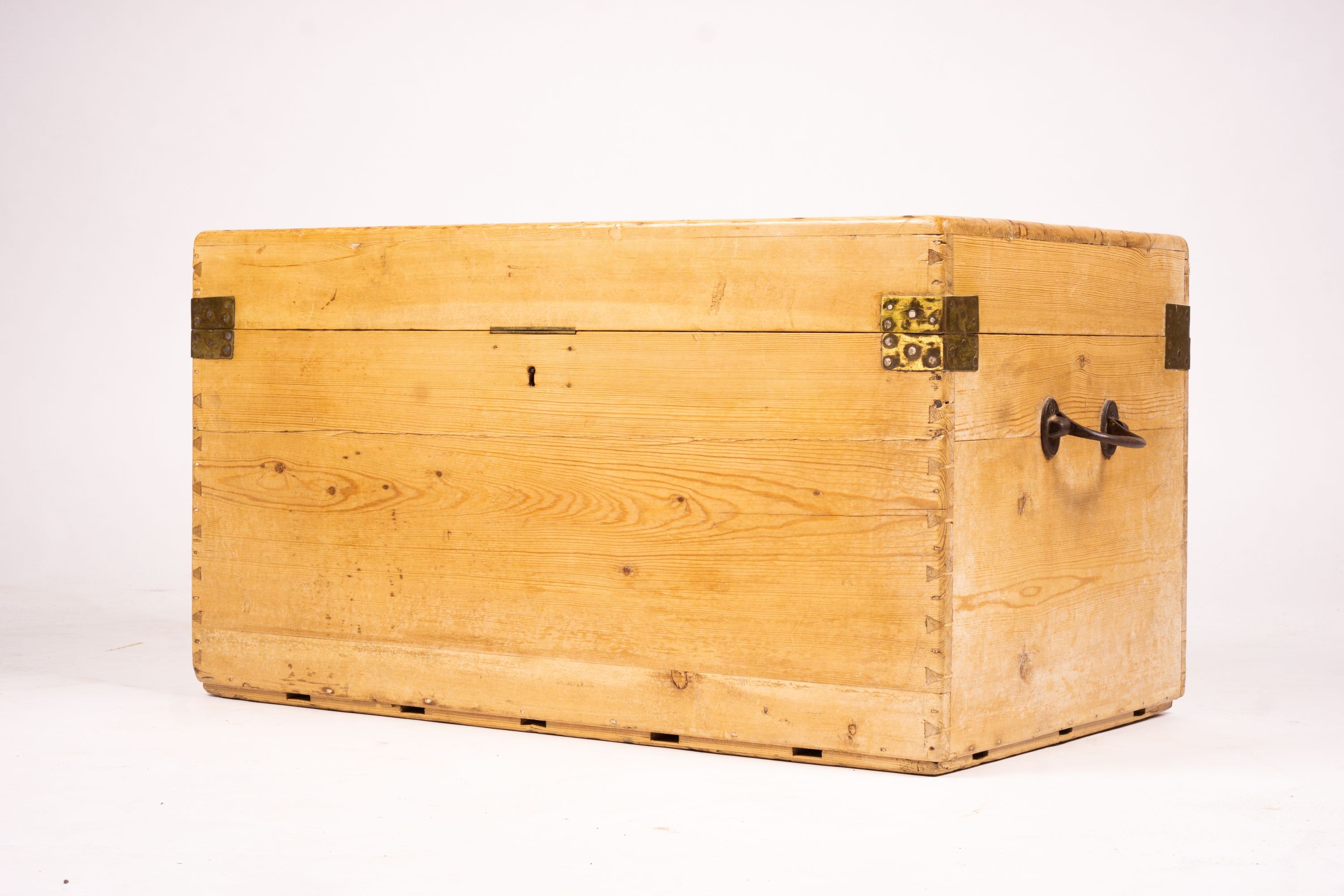 A small Victorian brass bound rectangular pine trunk, length 76cm, depth 46cm, height 42cm